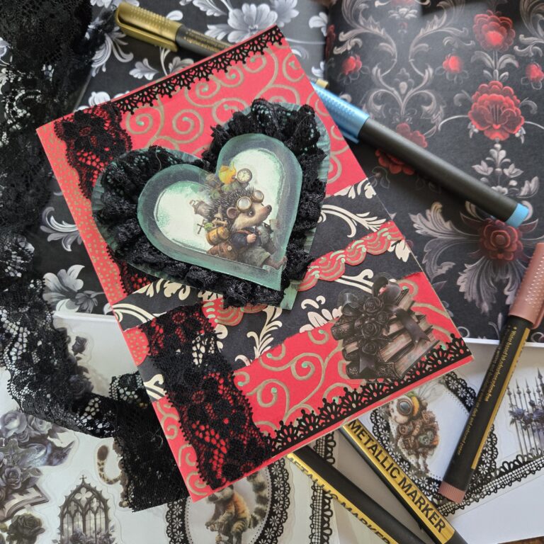 The front of a valentine card with an image of a steampunk hedgehog mounted in front of a white heart. The heart is fringed with black lace and centered on a red background with black and white floral decorations.